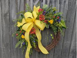 A bright spring wreath hung in a doorway
