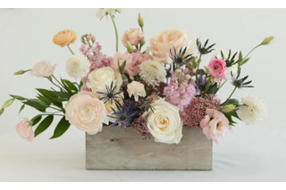 Jubilent pink, purple, peach and white florals in a wooden container