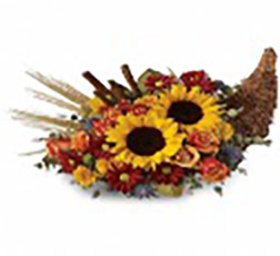 A cornucopia of earthen accents and fall colored flowers
